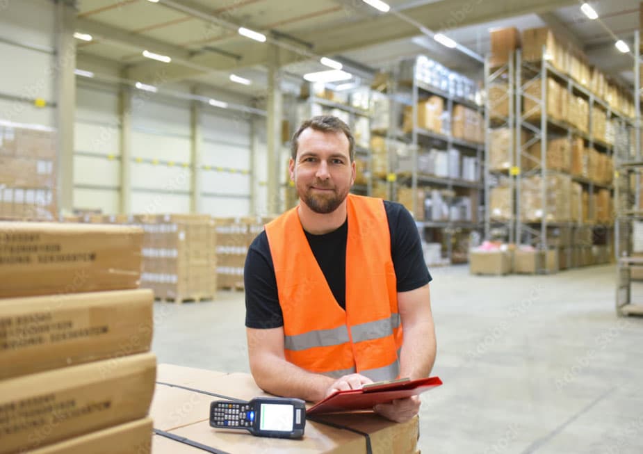 about-us man wearing hi-vis in warehouse